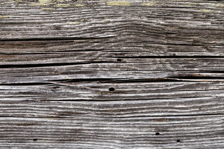 Old dark colored logs for background, texture of old woodの写真素材