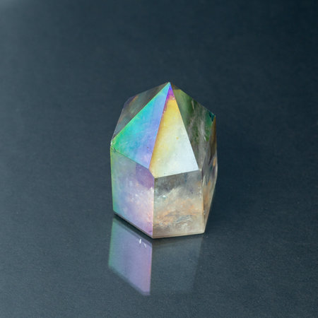 Closeup picture of pure quartz mineral gemstone isolated on a gray backgroundの写真素材