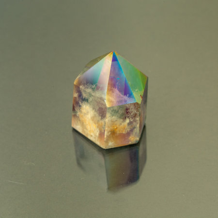 Closeup picture of pure quartz mineral gemstone isolated on a gray backgroundの写真素材