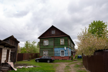 Wooden old barrack-type house, old housing in a big cityの写真素材