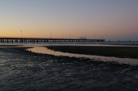 Sunset silhouette beach dusk scene の写真素材
