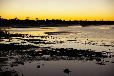 Sunset silhouette beach dusk scene の写真素材
