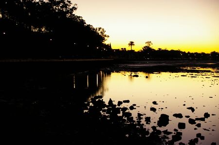 Sunset silhouette beach dusk scene の写真素材