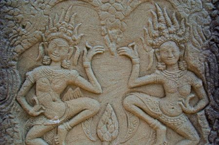 two aspara dancers carved into the stone of bayon temple angkor