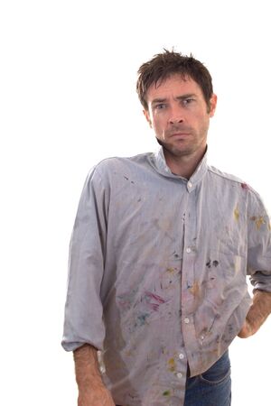 Paint covered home handy man contemplating decorating ideas の写真素材