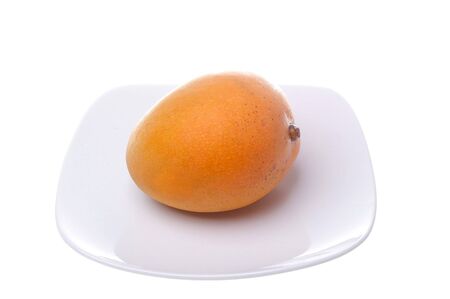 Mango on china plate ready for eatingの写真素材