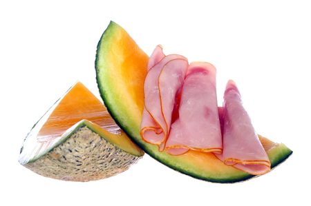 antipasto of ham and rockmelon or cantaloupe isolated on whiteの写真素材