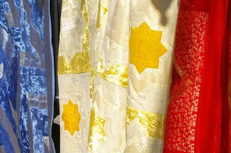 Group of sarongs hanging for sale at marketの写真素材