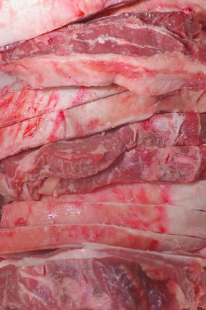 Raw BBQ lamb chops stacked in close up macroの写真素材