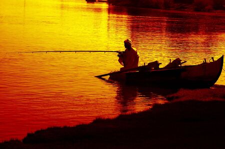 traditional muslim village fisherman on the nile in aswan eygpt の写真素材
