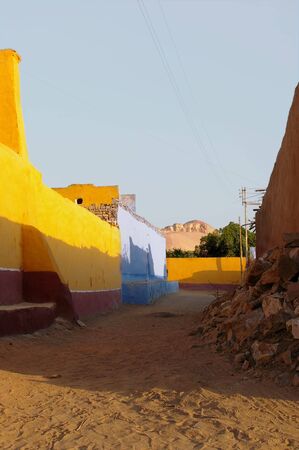 Nubian village in bright santa fe colors with ancient rock building backgroundの写真素材