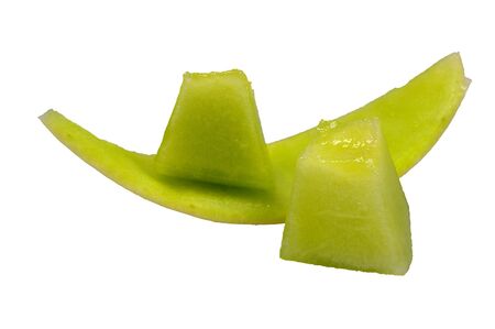 chunks of honeydew melon isolated on whiteの写真素材