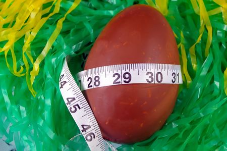 easter egg with tape showing diet concernsの写真素材