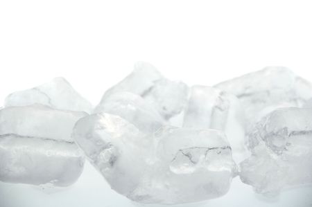frozen real ice cube background isolated over whiteの写真素材