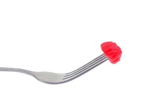 jelly lolly on fork isolated over whiteの写真素材