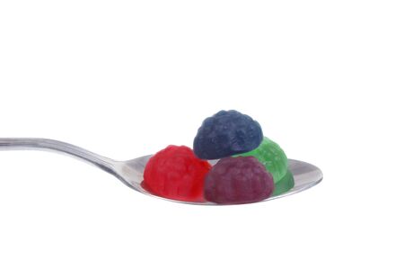 jelly lolly on spoon isolated over whiteの写真素材
