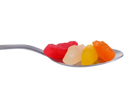 jelly lolly on spoon isolated over whiteの写真素材