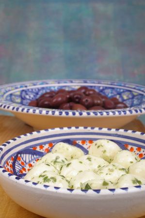 chived bocconcini cheese and black kalamata olives の写真素材