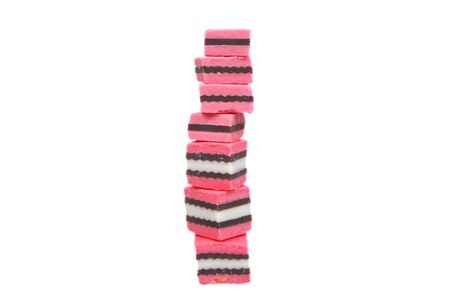 pink and black licorice isolated over whiteのeditorial素材