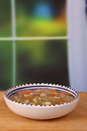 chicken noodle soup with carrot and onionの写真素材