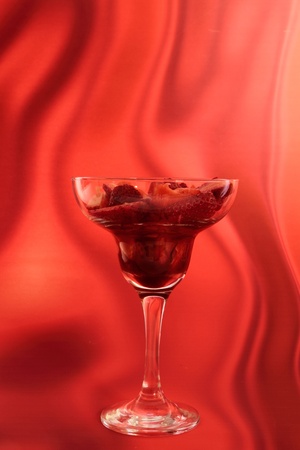 strawberry in cocktail glass with syrup of chocolate or vinegarの写真素材