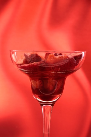 strawberry in cocktail glass with syrup of chocolate or vinegarの写真素材