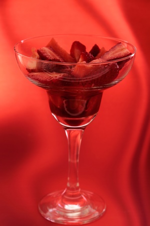 strawberry in cocktail glass with syrup of chocolate or vinegarの写真素材