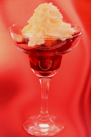 strawberry in cocktail glass with syrup of chocolate or vinegar and creamの写真素材