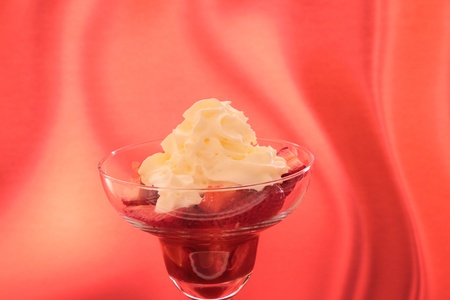 strawberry in cocktail glass with syrup of chocolate or vinegar and creamの写真素材