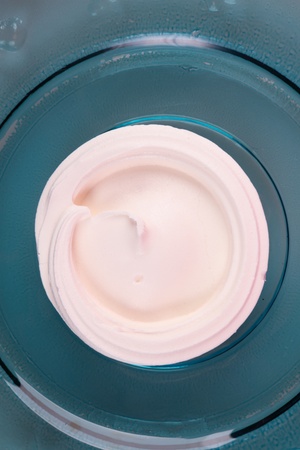 meringue case or shell on blue glass plateの写真素材