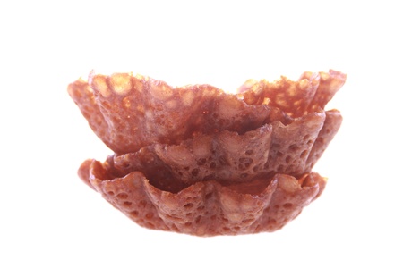 brown brandy snap basket isolated over whiteの写真素材