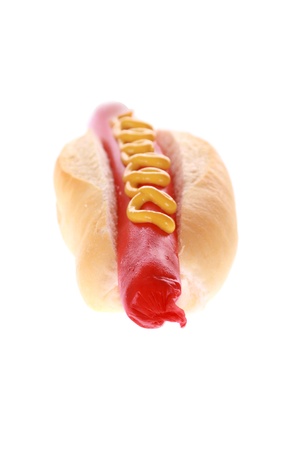 extra large foot long hot dog and mustard in bun isolatedの写真素材