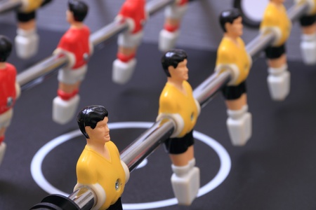 foosball table soccer little men playing gameの写真素材