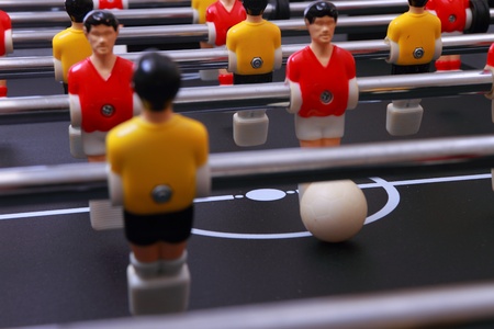 foosball table soccer little men playing gameの写真素材
