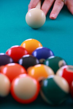 woman breaking billard balls close up imageの写真素材
