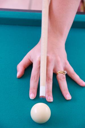woman breaking billard balls close up image