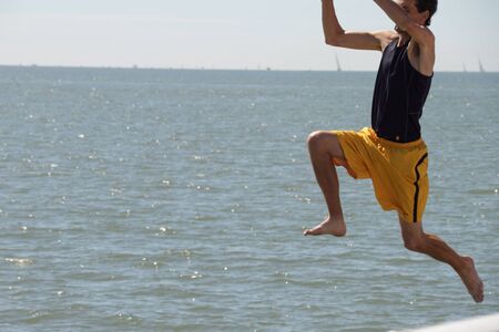 BRISBANE, AUSTRALIA - APR 22 : The Brisbane to Gladstone Yacht Race excites man to jump of pier  April 22, 2011 in Brisbane, Australia のeditorial素材