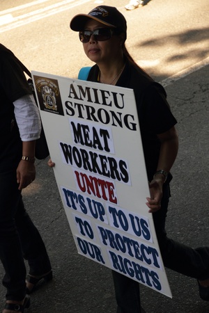 BRISBANE, AUSTRALIA - MAY 2 : Labour day street march protesting workers rigths woman holding Meat union placard May 2, 2011 in Brisbane, Australia のeditorial素材