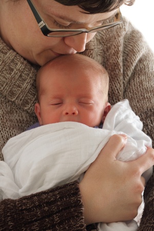 newborn baby cuddle snuggle with parent pictureの写真素材