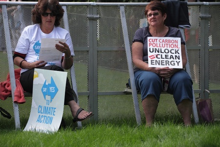 BRISBANE, AUSTRALIA - JUNE 6 : older women with clean anergy and say yes to carbon tax protest signs at during World Enviroment Day rally 6, 2011 in Brisbane, Australiaのeditorial素材