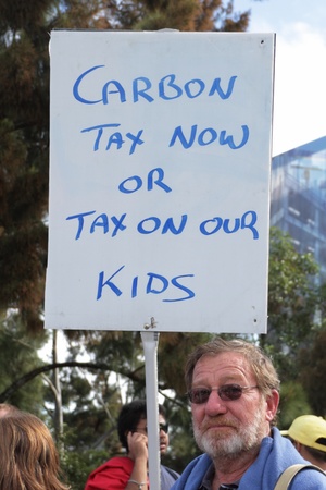 BRISBANE, AUSTRALIA - JUNE 6 : man with pro carbon tax sign during World Enviroment Day say yes protest 6, 2011 in Brisbane, Australia のeditorial素材