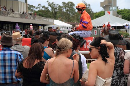 BRISBANE, AUSTRALIA  NOV 01 : Crowds gather to watch horses in the mounting yard Eagle Farm Racourse as part of Melbourne Cup events across Australia November 01, 2011 in Brisbane, Australia のeditorial素材