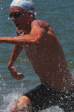 BRISBANE, AUSTRALIA  NOV 27 :Elite male swimmer sprinting to finish of dash for cash in Great Australian Swim Series race November 27, 2011 in Brisbane, Australia のeditorial素材