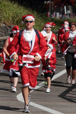 BRISBANE, AUSTRALIA  NOV 27 :Group of unidentified santas gather for warm up pre Variety Santa Fun Run November 27, 2011 in Brisbane, Australia のeditorial素材