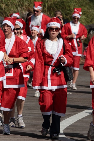 BRISBANE, AUSTRALIA  NOV 27 :Unidentified asian santa takes relaxed fashion approach to the Variety Santa Fun Run November 27, 2011 in Brisbane, Australia のeditorial素材