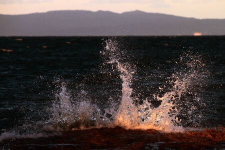 ocean spray over rocks abstract background brisbaneの写真素材