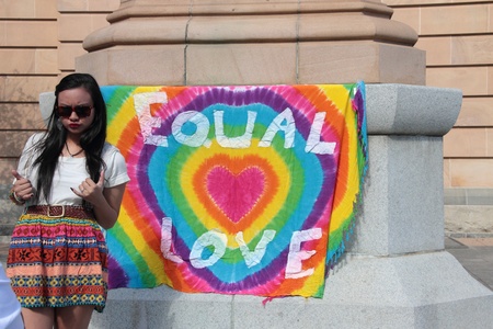 BRISBANE, QLD AUSTRALIA - AUGUST 11 : Equal love sign at protest on Queen Victoria statue with unidentifed woman posing on August 11 2012  in Brisbane, Australia  Equal Love is a gay rights group supporting gay marのeditorial素材