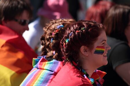 BRISBANE, QLD AUSTRALIA - AUGUST 11 : Unidentified woman smiling in support of speeches on August 11 2012  in Brisbane, Australia  gay rights activists had large crowd support during speechesのeditorial素材