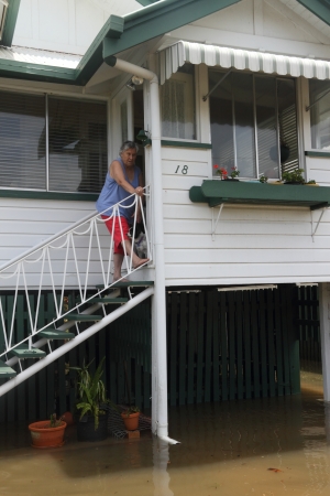 BRISBANE, AUSTRALIA - JANUARY 28 : Unidentified resident surveys flood damage from ex tropical cyclone Oswald on January 28, 2013 in Brisbane, Australiaのeditorial素材