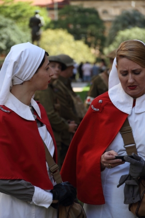 BRISBANE, AUSTRALIA - APRIL 25 : Unidentified World War 2 reenactors texting during Anzac day commemorations  April 25, 2013 in Brisbane, Australiaのeditorial素材